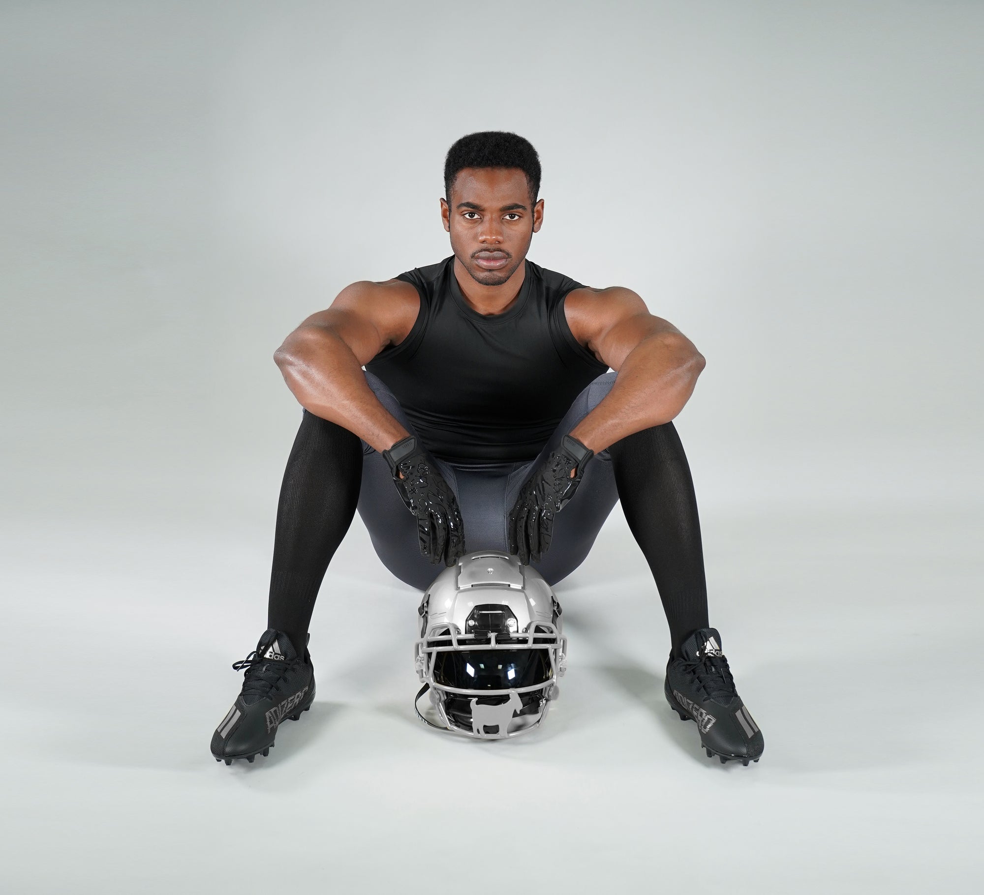 high socks for men and a guy with an American football helmet
