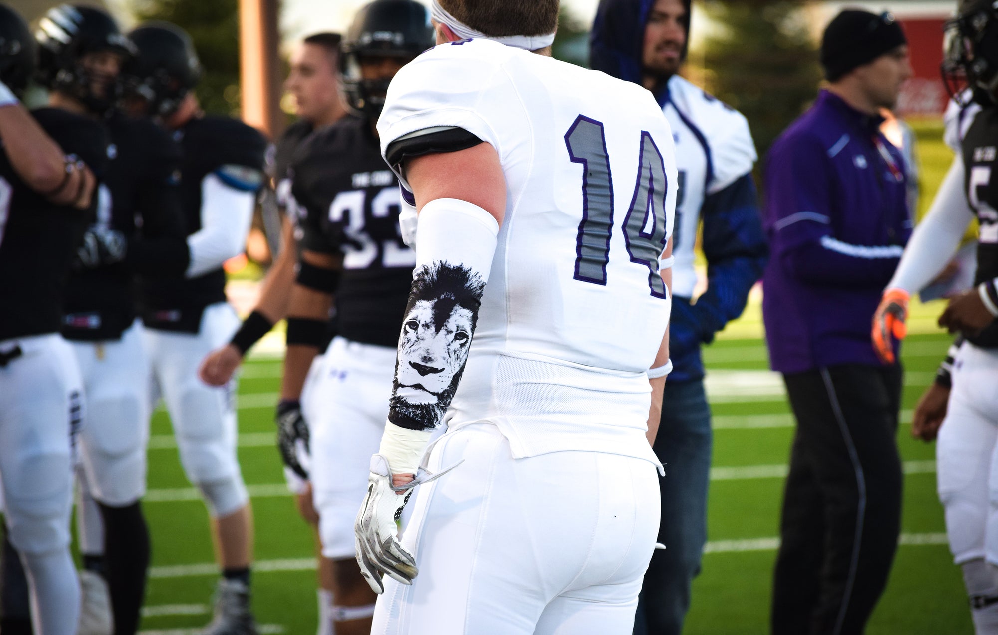 American football players wearing arm sleeves